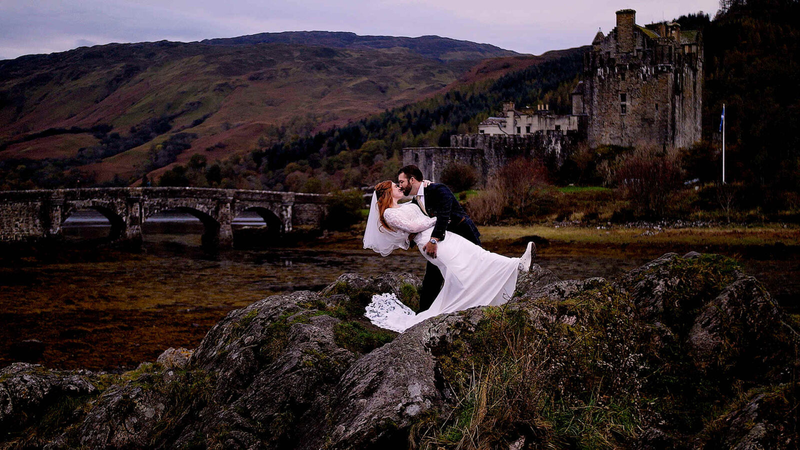Cinematic wedding film of Ashley and Connor at Eilean Donan Castle, featuring the iconic Scottish castle and the surrounding Highland lochs. An Elopement Film in Scotland.