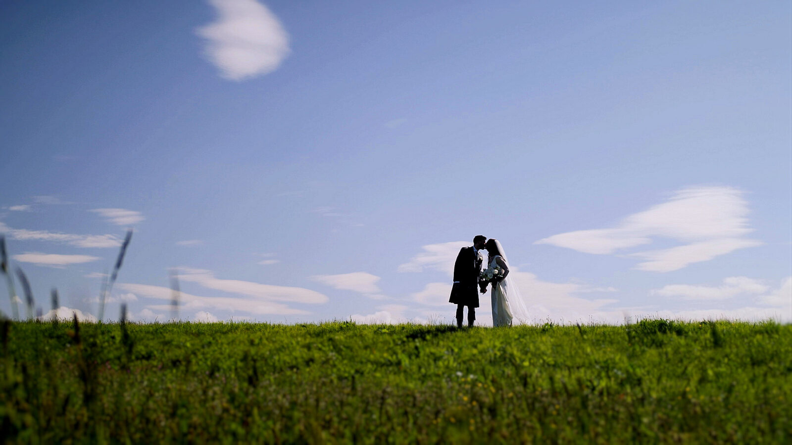 Wedding couple Nicola and Shane posing at Culloden Battlefield after their wedding at Kingsmills Hotel, Inverness.